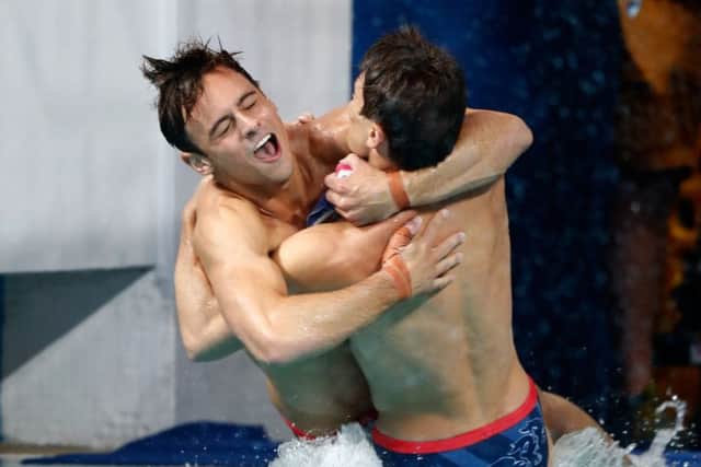 Tom Daley, left, and Dan Goodfellow celebrate their diving bronze