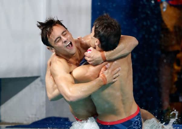 Tom Daley, left, and Dan Goodfellow celebrate their diving bronze