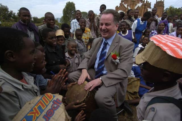 Pupils from the Henry Henderson Institute in Malawi instruct First Minister Jack McConnell on drum technique in May 2005. Picture: Donald MacLeod/TSPL