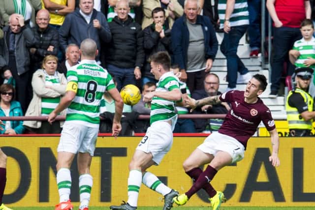 Hearts' Jamie Walker, right, goes down in the box and a penalty is awarded against Celtic. Teh winger has been charged with diving. Picture: SNS