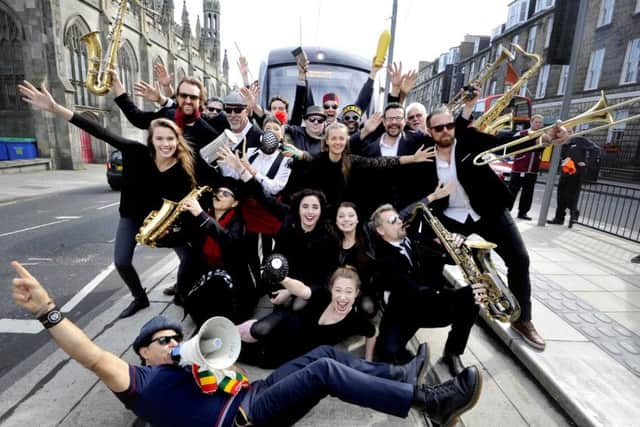Musicians from the Melbourne Ska Orchestra entertained festival goers and commuters at York Place. Picture: Colin Hattersley