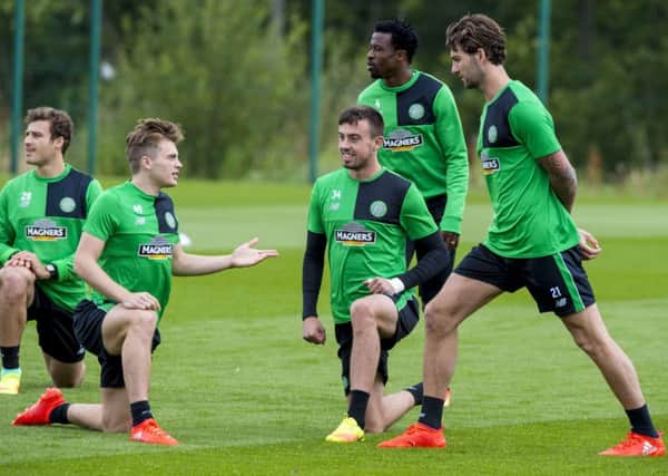 Celtic's James Forrest, left, with Eoghan O'Connell and Charlie Mulgrew at training. Picture: SNS