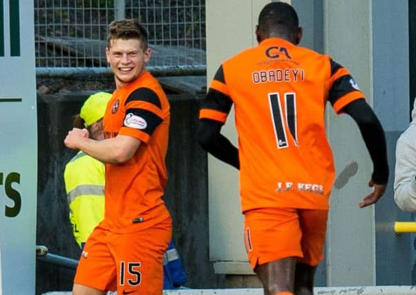 Dundee United's Cammy Smith, left, celebrates making it 2 - 0
