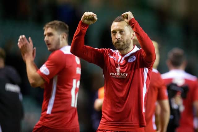 Queen of the South's Stephen Dobbie celebrates beating Hibs and reaching the quarter-finals of the Betfred Cup. Picture: Graham Stuart/SNS