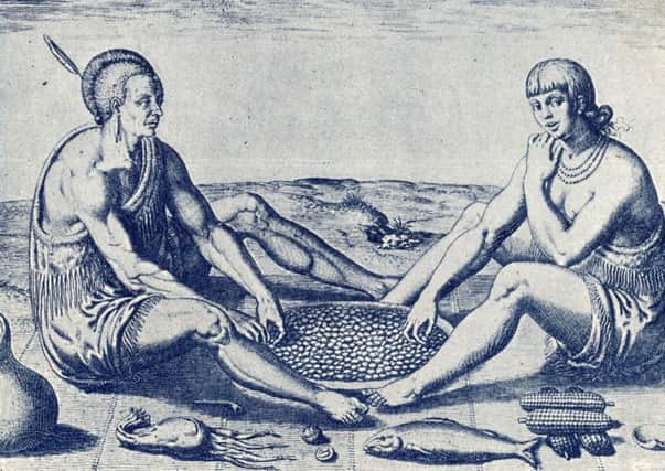 Native Americans eating maize in an engraving by Theodor de Bry published from 1588.   New genetic evidence casts doubt on the theory that their ancestors walked across from SIberia 12,600 years ago. Picture: Getty
