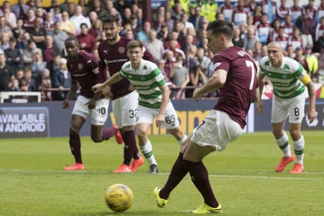 Jamie Walker scores the penalty he won in controversial circustances against Celtic. Picture: Steve Welsh/Getty Images