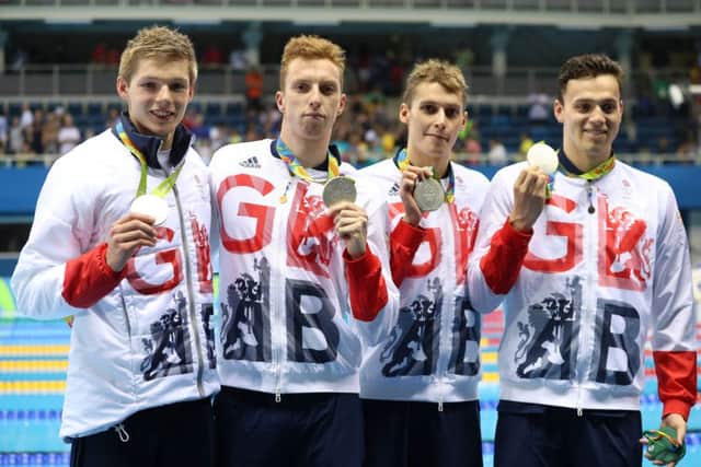 Great Britain's Duncan Scott, Dan Wallace, Stephen Milne and James Guy with their silver medals in the Men's 4 x 200m Freestyle Final