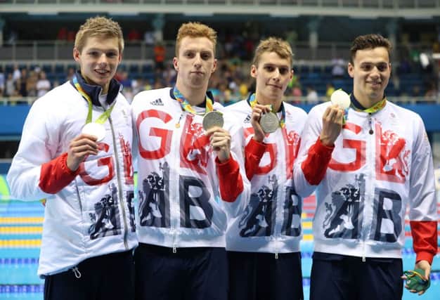Great Britain's Duncan Scott, Dan Wallace, Stephen Milne and James Guy with their silver medals in the Men's 4 x 200m Freestyle Final