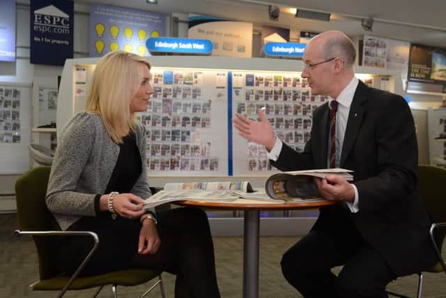 John Swinney chats to first-time buyer Laura Dow ahead of the passing of legislation designed to help people get on the housing ladder in 2013. Picture: Neil Hanna/TSPL