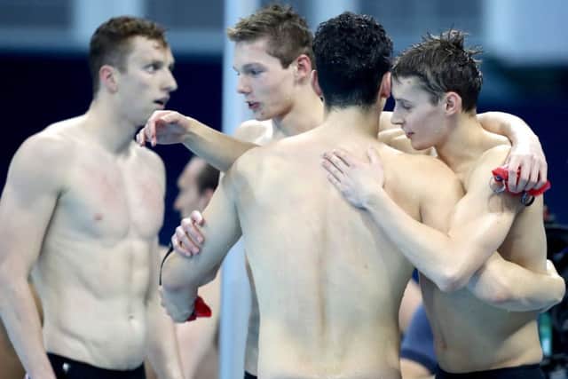 Britains squad, from left, James Guy, Stephen Milne, Duncan Scott and Dan Wallace celebrate their silver medal after finishing second to Team USA  in the 4x200m freestyle relay. Picture: PA