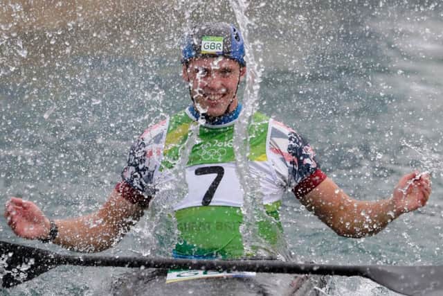 Joe Clarke celebrates after winning gold for Britain in the kayak (K1) final. Picture: Jamie Squire/Getty Images