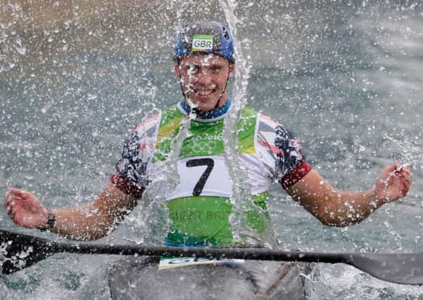 Joe Clarke celebrates after winning gold for Britain in the kayak (K1) final.  Picture: Jamie Squire/Getty Images
