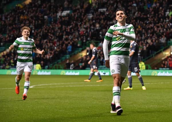All smiles after Tom Rogic, right, opens the scoring. Picture: SNS