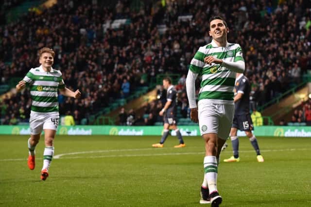 All smiles after Tom Rogic, right, opens the scoring. Picture: SNS