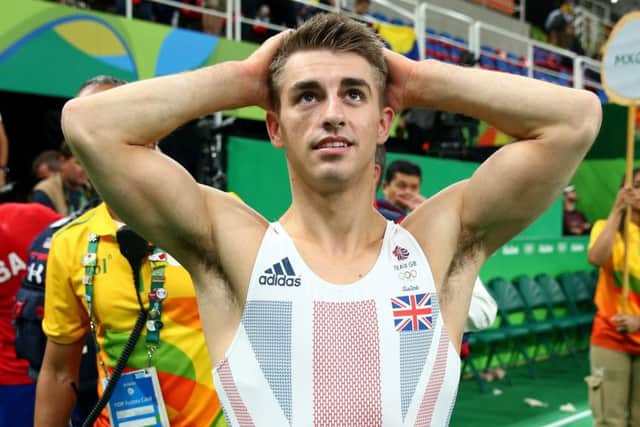 GB gymnast Max Whitlock reacts after winning his bronze medal