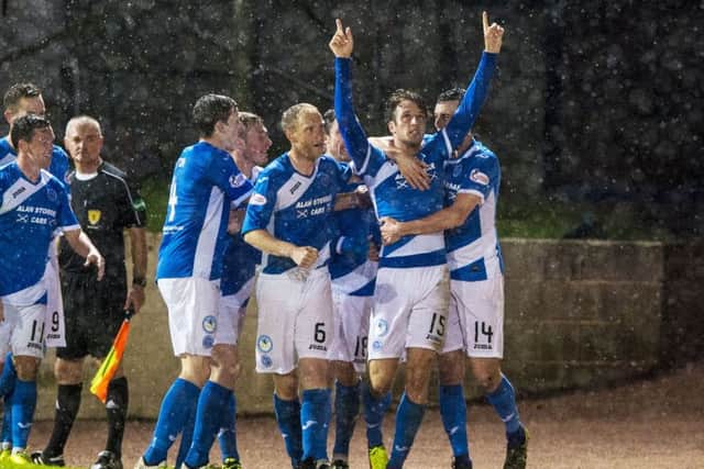 Brad McKay points skywards in tribute after scoring the winner against former club Hearts.