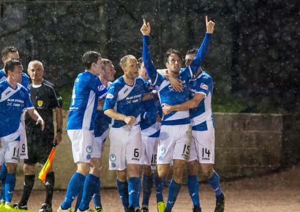 Brad McKay points skywards in tribute after scoring the winner against former club Hearts.
