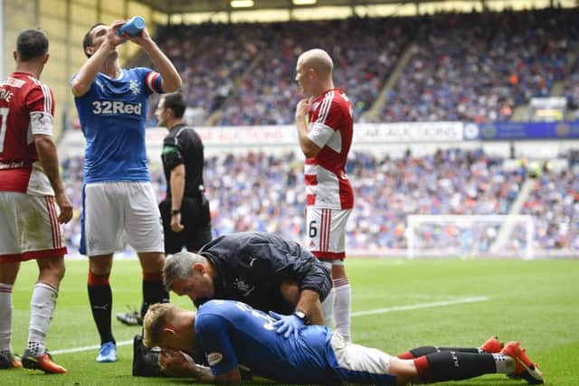 Martyn Waghorn receives on-field attention after being injured against Hamilton. Picture: SNS.