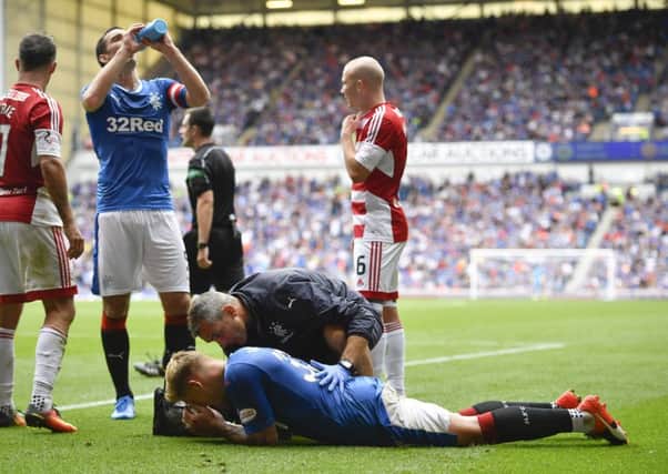Martyn Waghorn receives on-field attention after being injured against Hamilton. Picture: SNS.