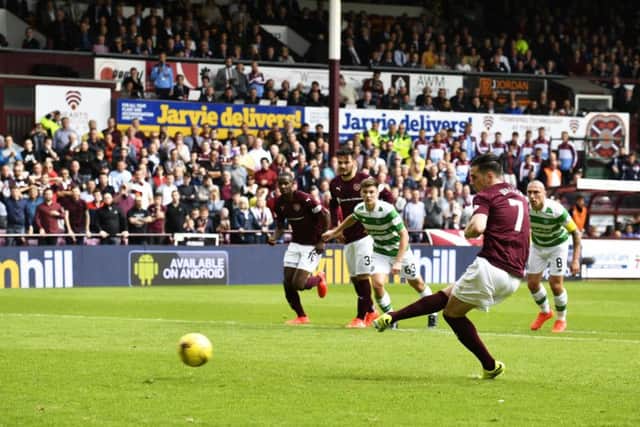 Jamie Walker tucks away the penalty after "diving" to win the spot-kick. Picture: SNS