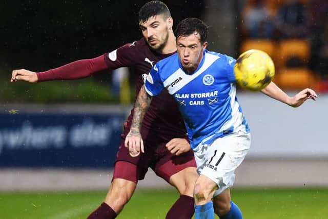 Hearts' Callum Paterson puts in a battling peformance against St Johnstone's Danny Swanson. Picture: Paul Devlin/SNS