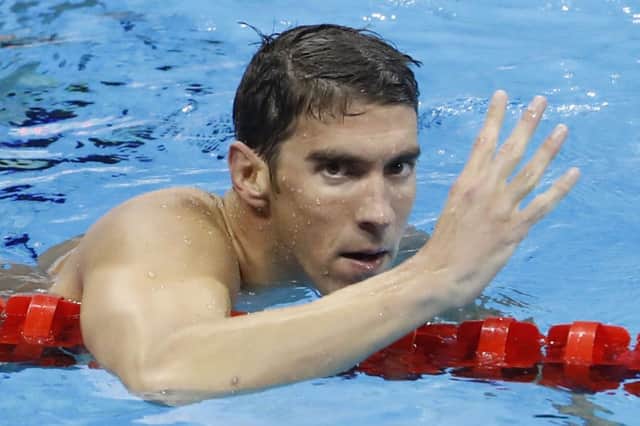 Michael Phelps celebrates his fourth gold of the Rio Games and fourth straight 200m IM Olympic title