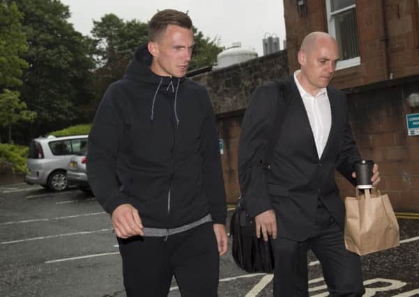 Dorus de Vries (left) arrives for his medical with physio Tim Williamson. Picture: SNS Group