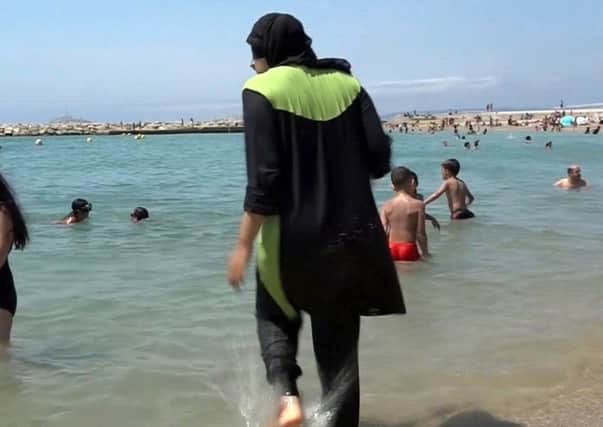 The French resort of Cannes has banned full-body, head-covering swimsuits worn by some Muslim women from its beaches, citing security concerns. Pic: AP