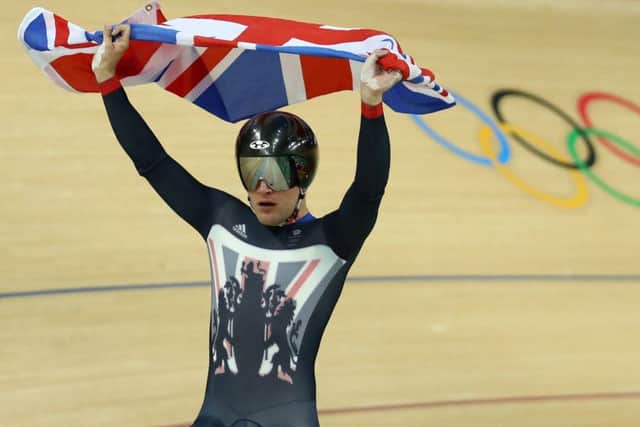 Callum Skinner celebrates after helping Britain win gold in the men's team sprint track cycling. Picture: Bryn Lennon/Getty Images