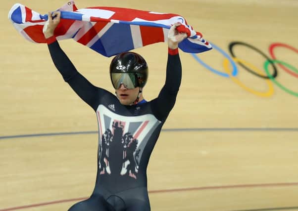 Callum Skinner celebrates after helping Britain win gold in the men's team sprint track cycling.  Picture: Bryn Lennon/Getty Images