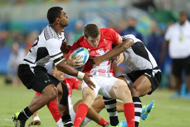 Fiji's Vatemo Ravouvou gets to grips with Britain's Mark Bennett during the Olympic rugby sevens final. Picture: Owen Humphreys/PA Wire