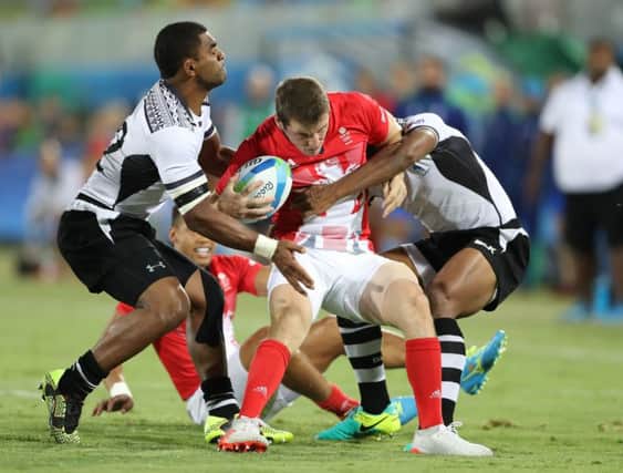 Fiji's Vatemo Ravouvou gets to grips with Britain's Mark Bennett during the Olympic rugby sevens final. Picture: Owen Humphreys/PA Wire