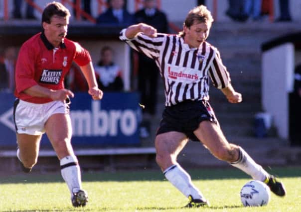 Istvan Kozma (right), watched by St Mirren's Tom Black in October 1989.