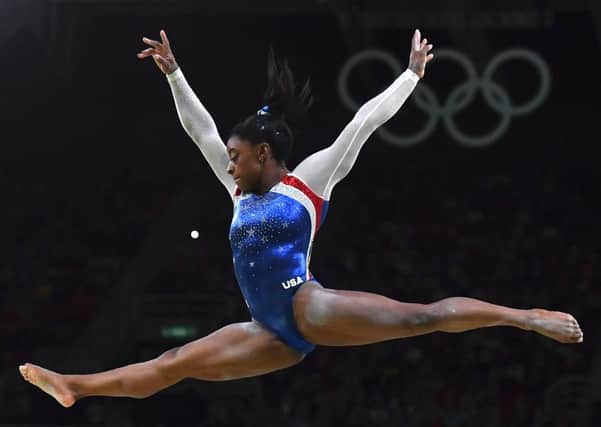 Simone Biles competes in the beam event of the womens individual all-around final of 
the Artistic Gymnastics. Picture: Ben Stansall