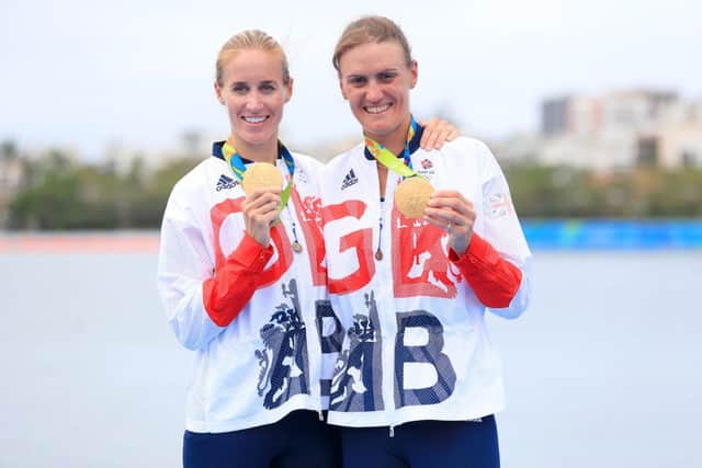 Great Britain's Helen Glover (left) and Heather Stanning (right) celebrate winning gold in the Women's Pair Final at The Lagoa Stadium. Picture: Mike Egerton/PA Wire.
