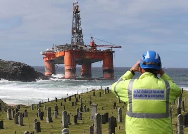 A coast guard monitors the Transocean Winner drilling rig on the coast of the Isle of Lewis. Picture: Andrew Milligan/PA