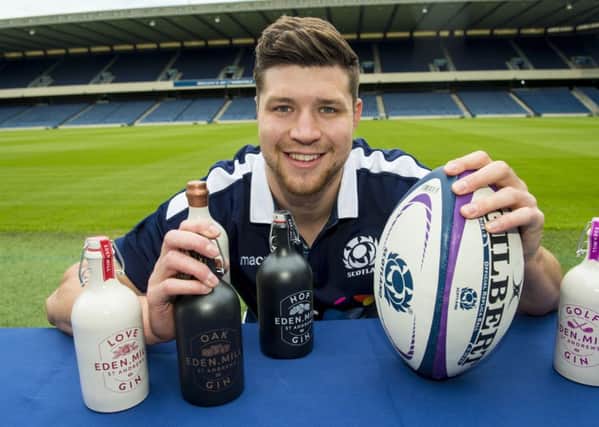 Scotland's Grant Gilchrist helps to promote the rugby team's new sponsorship agreement with Eden Mill Gin