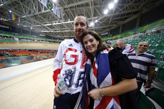 Sir Bradley Wiggins celebrates with his wife Catherine