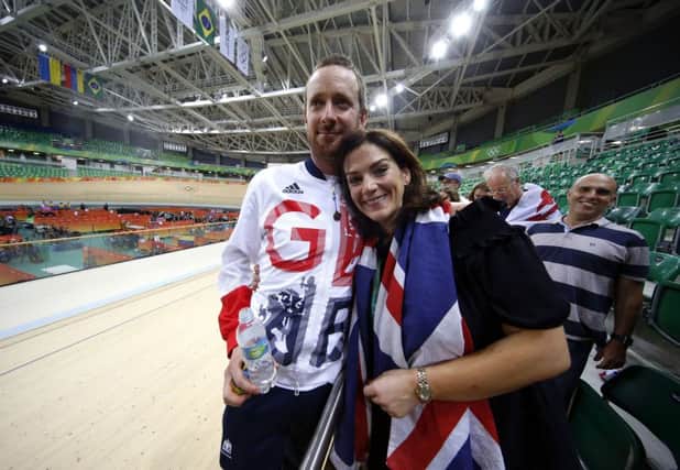 Sir Bradley Wiggins celebrates with his wife Catherine