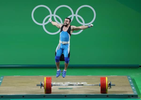 Nijat Rahimovs celebration on lifting gold  and its global viewing  encapsulates the Olympics. Photograph: Julian Finney/Getty