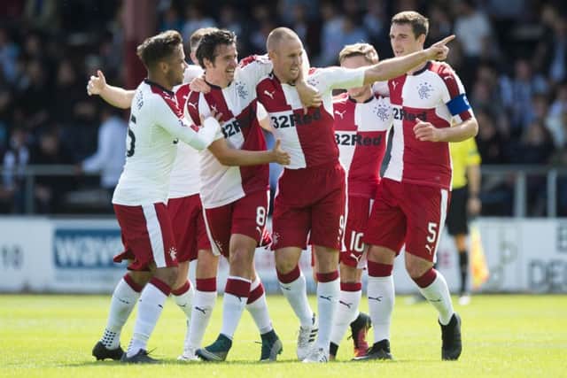 Rangers celebrate Kenny Miller's goal to put them two goals ahead. Picture: SNS