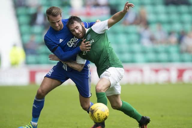 Andrew Shinnie (left) in action against Hibernian in a friendly at Easter Road last month. Picture: Getty Images