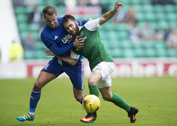 Andrew Shinnie (left) in action against Hibernian in a friendly at Easter Road last month. Picture: Getty Images