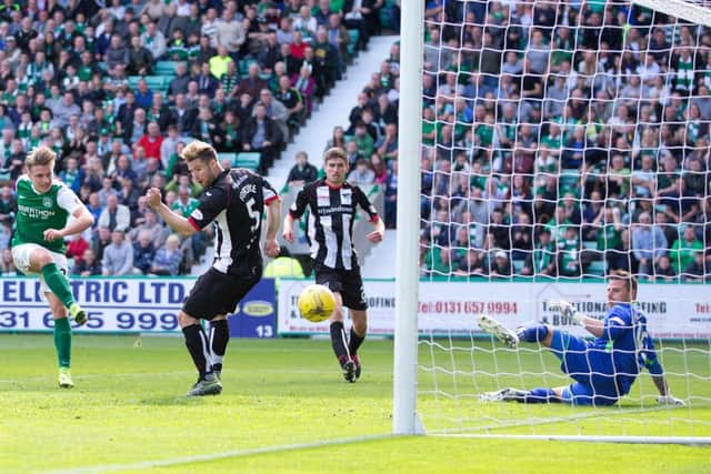 Jason Cummings celebrates the winning goal over Dunfermline at Easter Road. Picture: SNS