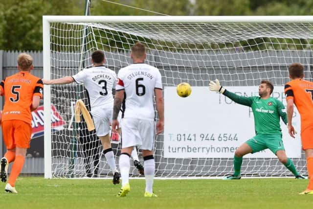 Dumbartons Mark Docherty leaves Cammy Bell grasping the air from the penalty spot. Picture: Gary Hutchison/SNS