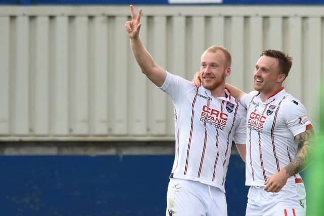 Liam Boyce (left) celebrates with Craig Curran after scoring a hat-trick for Ross County. Picture SNS