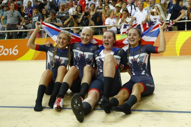 Katie Archibald, second from right, celebrates with the British squad after winning gold in the women's team pursuit final. Picture: Patrick Semansky/AP