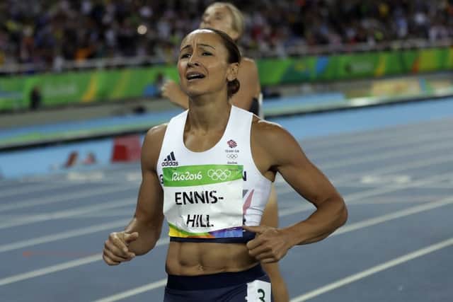 Jessica Ennis-Hill grimaces as she finishes the 800m but was soon smiling after taking silver