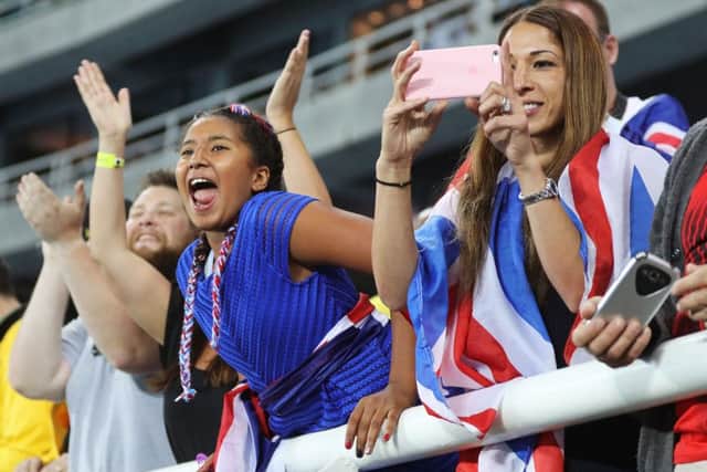 Farah's wife Tania and daughter Rihanna cheer from the stands. PICTURE: Owen Humphreys/PA Wire