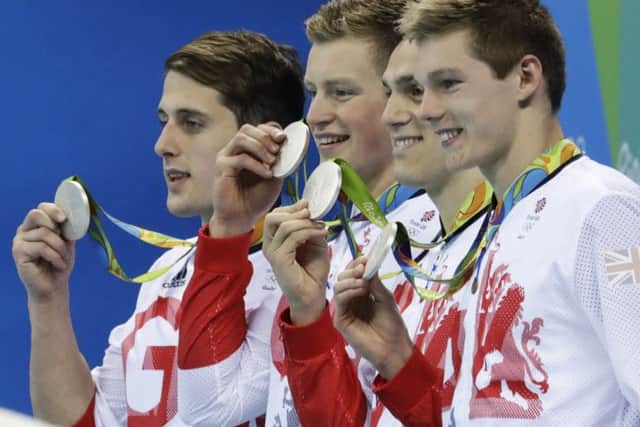 Scott, far right, James Guy, Adam Peaty and Chris Walker-Hebborn with their silver medals. PICTURE: AP